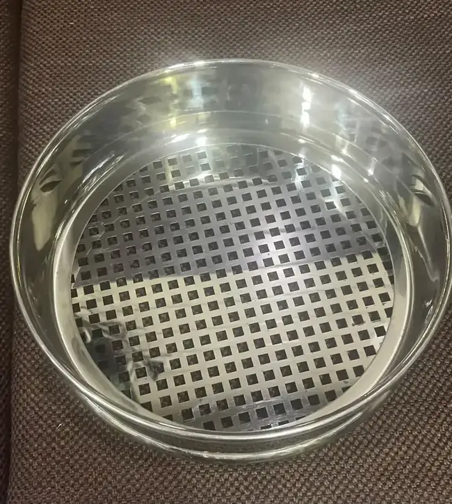 Perforated plate test sieve used for coarse particle size analysis